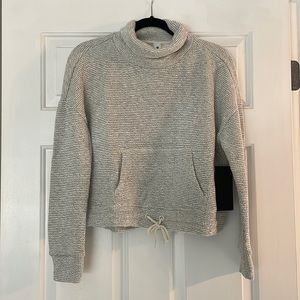 90 Degree by Reflex size M women’s sweater with synch tie at bottom.